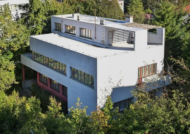 White modernist house with terrace