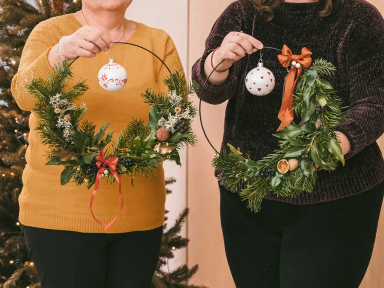 People holding wreaths with ornaments