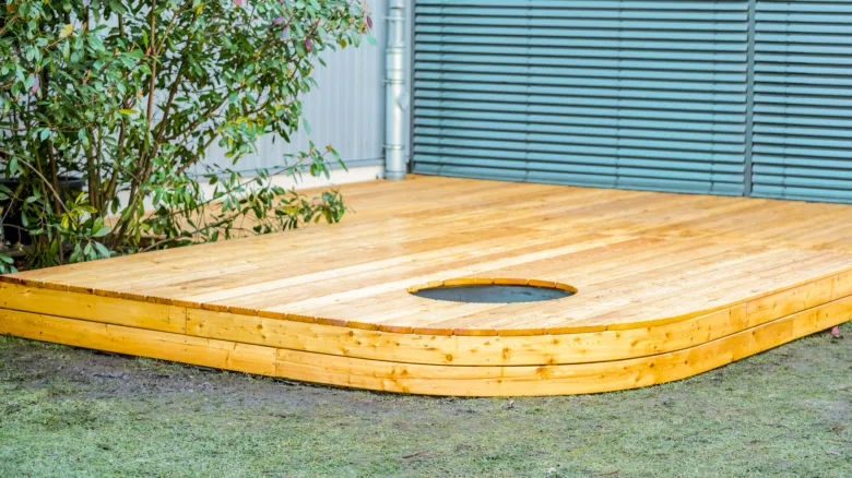 Finished wooden deck with hot tub cutout