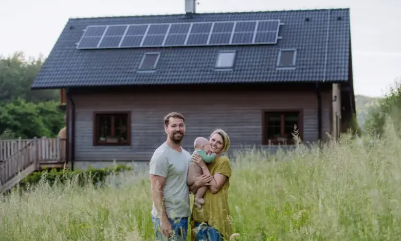 Family with solar panels on house