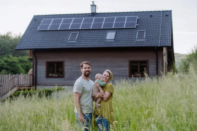 Family with solar panels on house